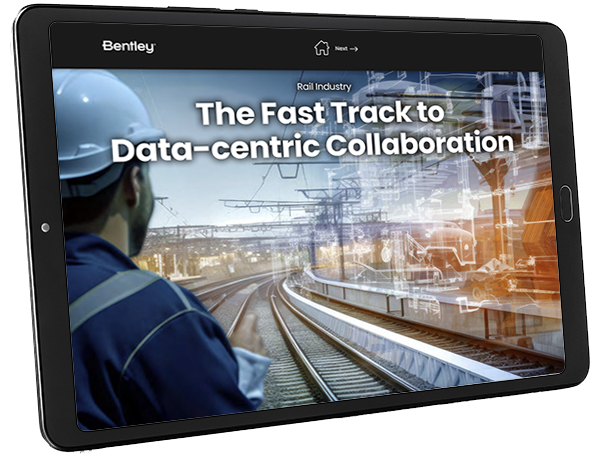 Worker viewing a digital presentation on the tablet about data-centric collaboration in the rail industry through Discover ProjectWise.